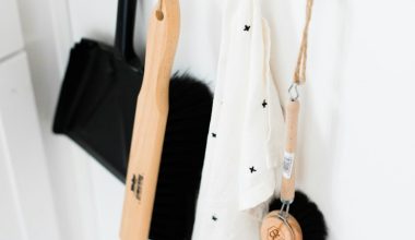 three black and brown bathroom cleaning tools