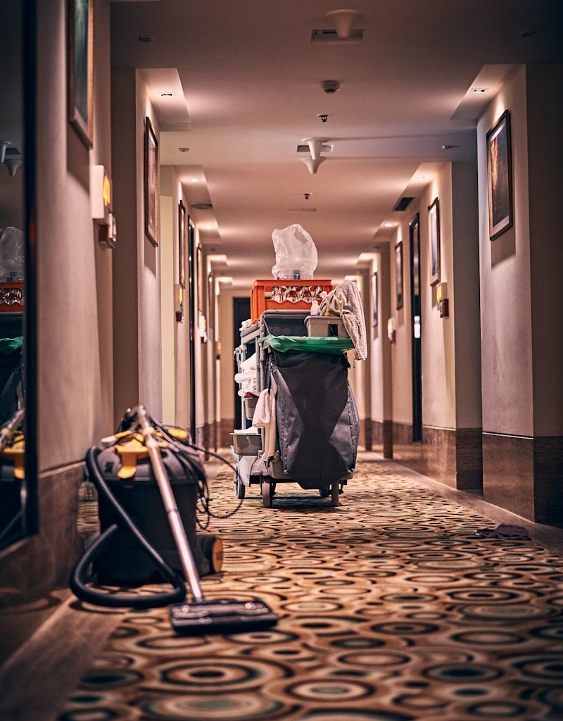 black and gray stroller on hallway