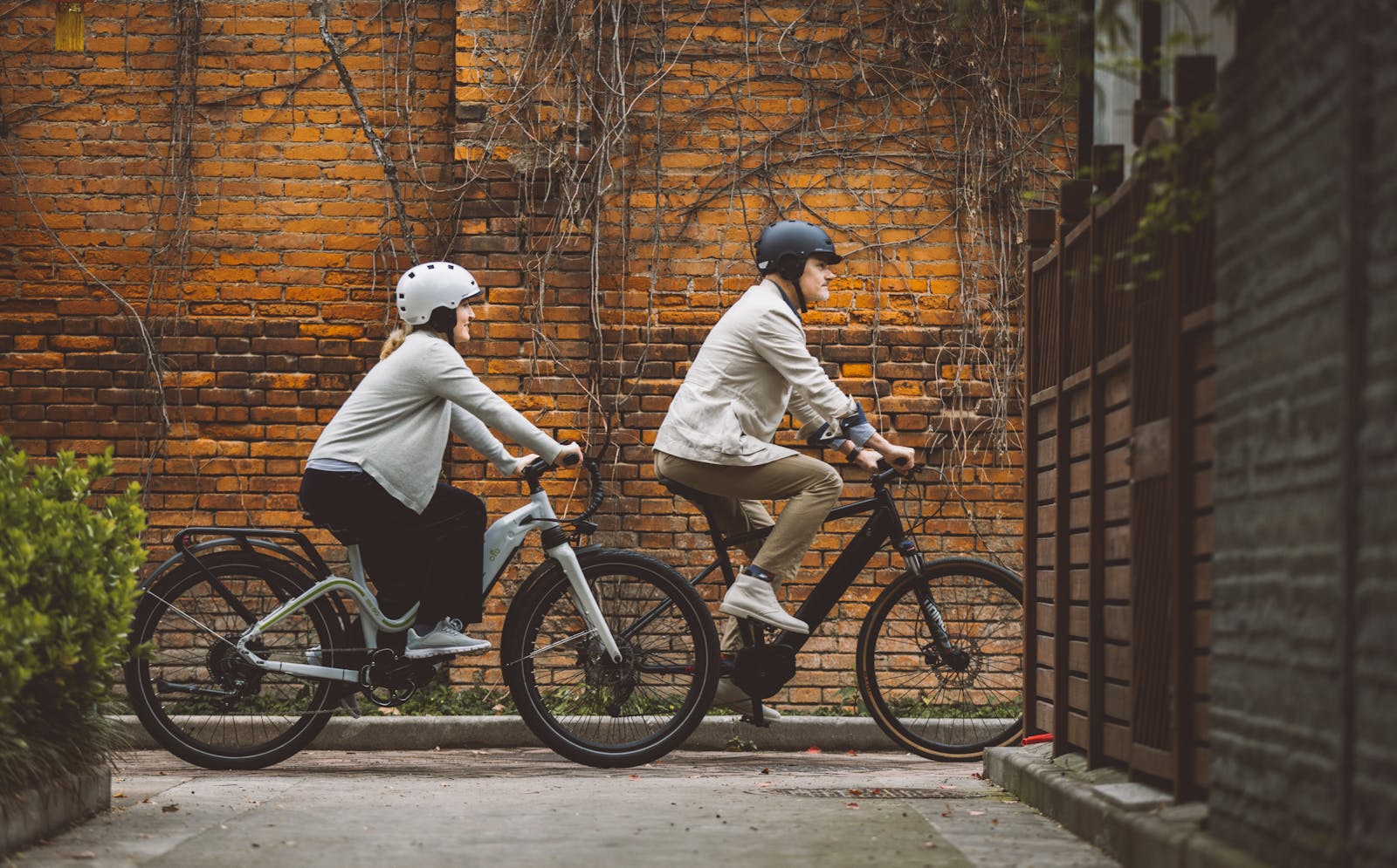 Couple Riding E-Bikes in a City