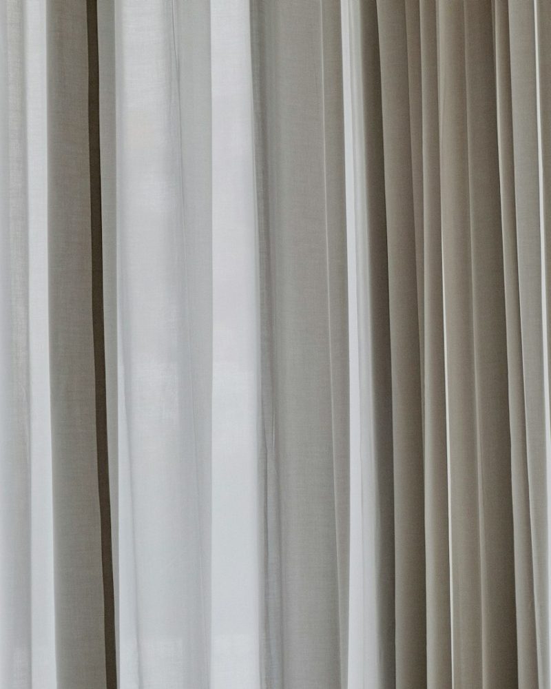 white and gray window curtain