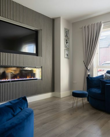 a living room filled with furniture and a flat screen tv